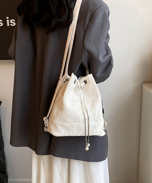 ショルダーバッグ バケツ型鞄 巾着バッグ レディース ミニリュック PUレザー 大人可愛い手提げ パール付きドローストリングバッグ おしゃれ 斜め掛け 3WAY鞄 77AIZHUO-001