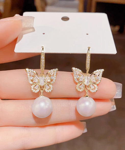 パールピアス韓国風揺れるピアスバタフライ 一粒フェイクパールピアス 蝶々モチーフ ビジューピアス 結婚式披露宴 キラキラピアスおしゃれ 上品耳飾り女性 フェミニン 83QH-004