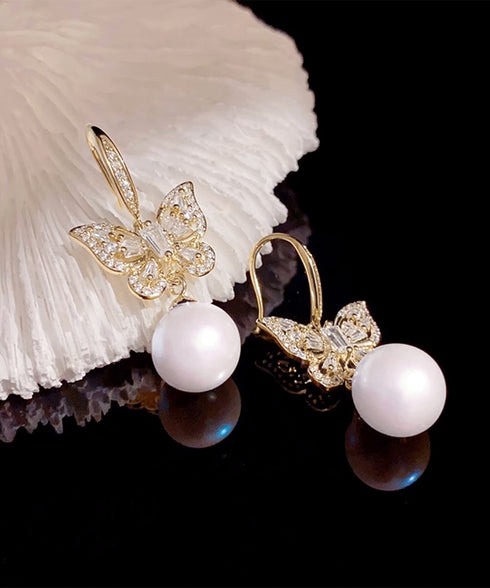 パールピアス韓国風揺れるピアスバタフライ 一粒フェイクパールピアス 蝶々モチーフ ビジューピアス 結婚式披露宴 キラキラピアスおしゃれ 上品耳飾り女性 フェミニン 83QH-004