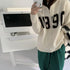 フード付き ニットカーディガン 秋冬服 ジップアップ ニットアウター レディース カレッジロゴ 長袖 中厚手ニット羽織 着やせフーデッドカーデ 韓国 カジュアル 84MEIRJ-003